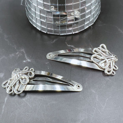 Gothic charm meets secure style with Octopus Tentacle Hair Clips. Displayed on a table.