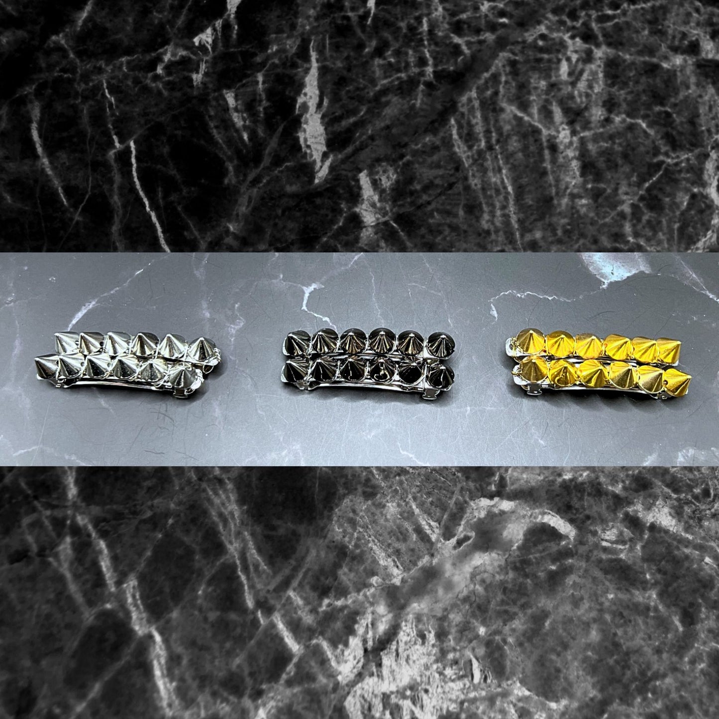 Edgy goth hair barrettes with silver, gunmetal, or gold spikes. Displayed on a table. Shows the color difference between the silver, gunmetal, and gold.