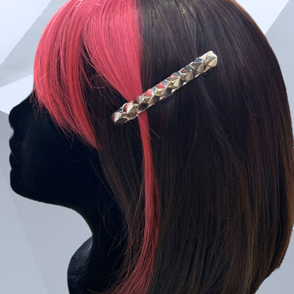 Edgy goth hair barrettes with silver, gunmetal, or gold spikes. Displayed on a mannequin. 3" silver clip.