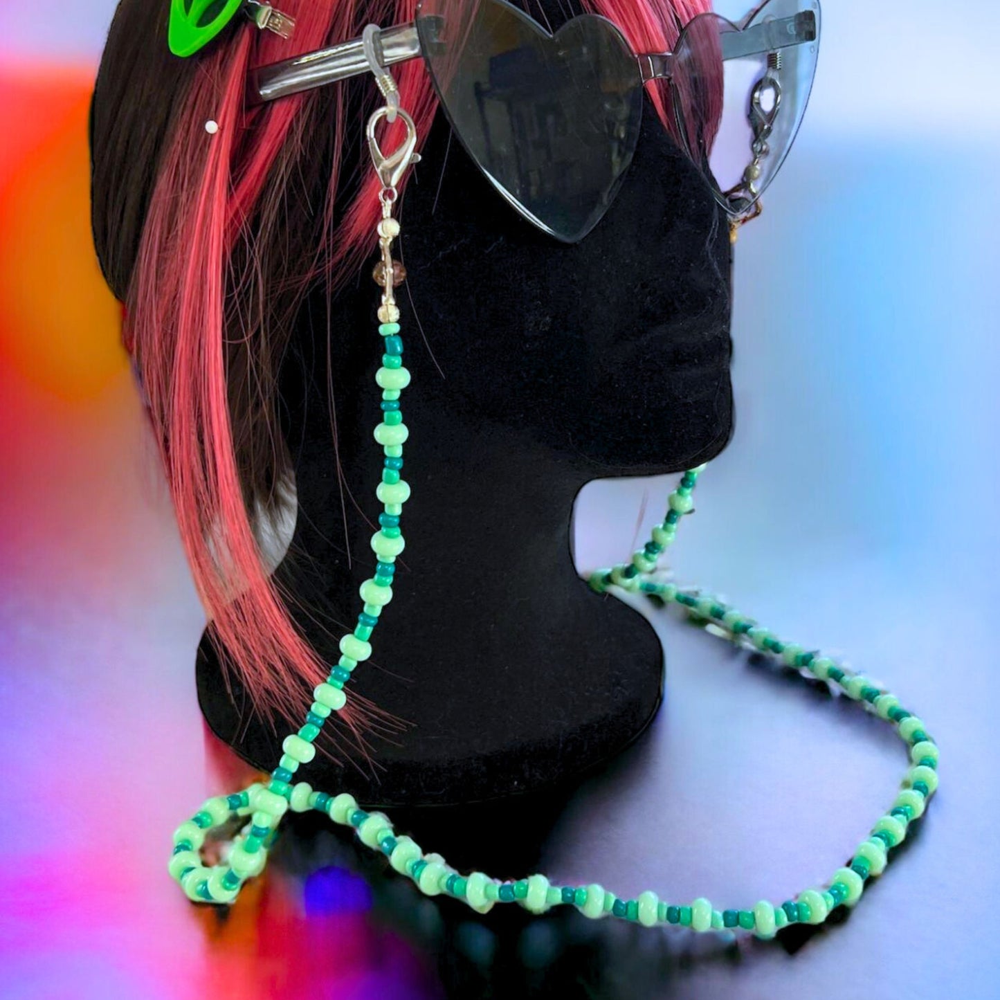 Mint blue and green beaded glasses chain with silver-tone clasps. Displayed on a mannequin.