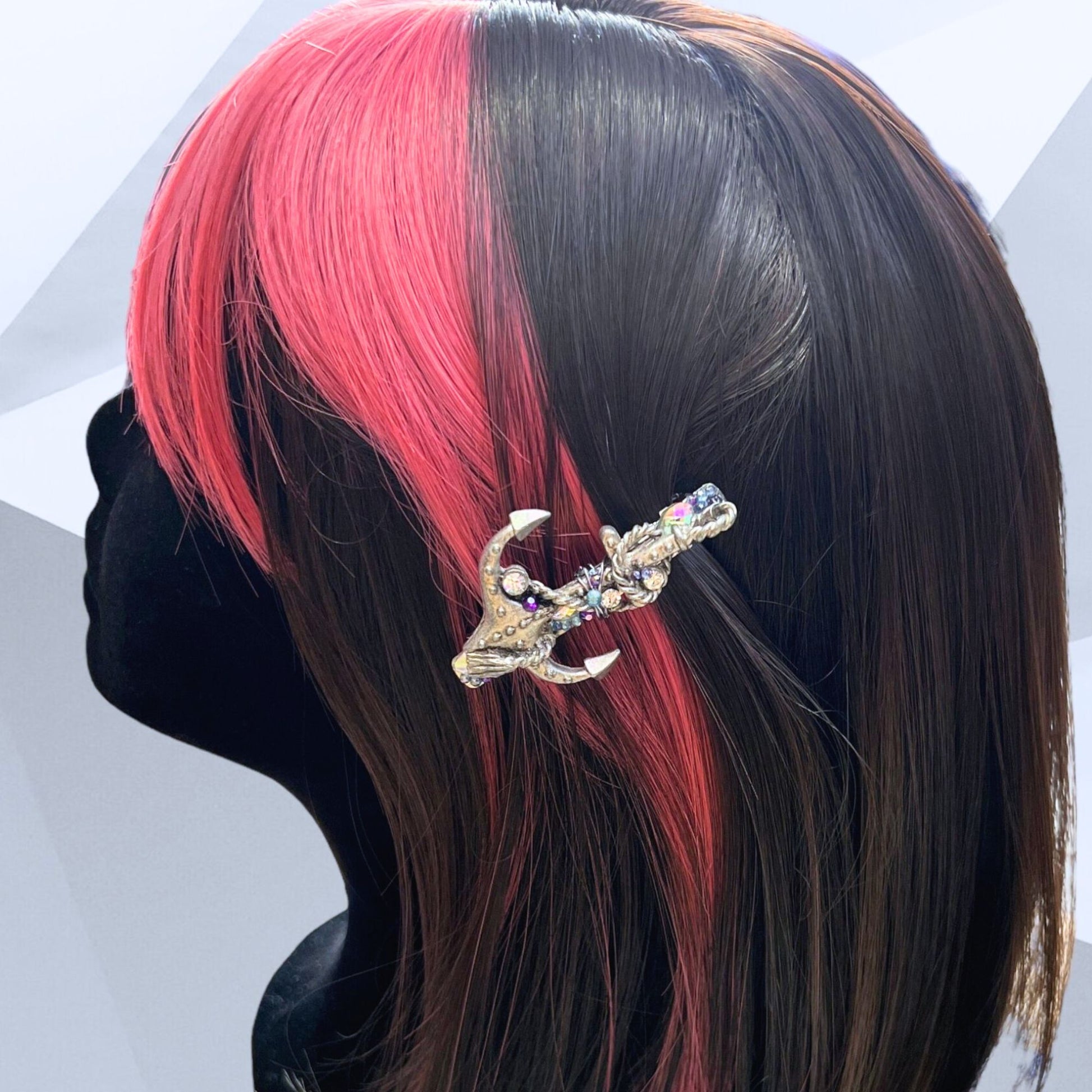 Silver metal hair barrette with vintage anchor pendant and blue/purple rhinestones. Displayed on a mannequin.