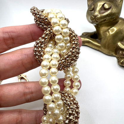 Vintage-inspired Pearl Pants Chain, a versatile accessory for jeans or bags. Displayed on a had with a close-up view of the beads.