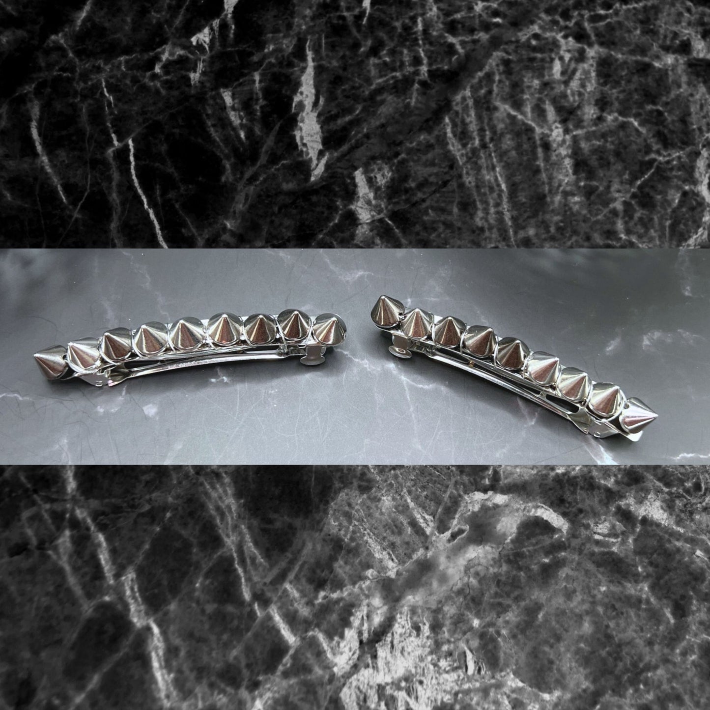 Edgy goth hair barrettes with silver, gunmetal, or gold spikes. Displayed on a table. 3" gunmetal clips.