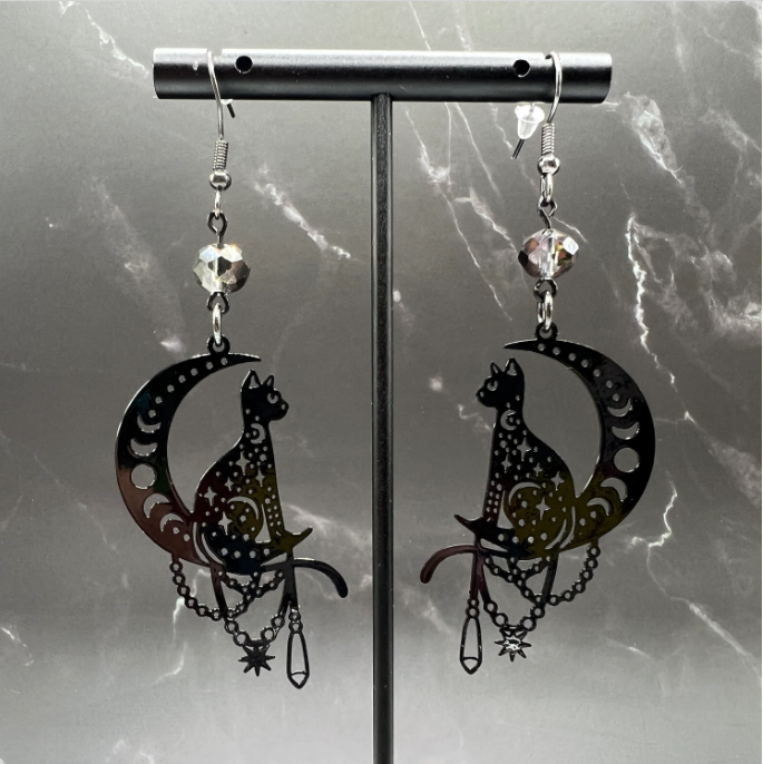 Close-up of Bohemian Beaded Cat Earrings featuring black cat charms and gray faceted beads.