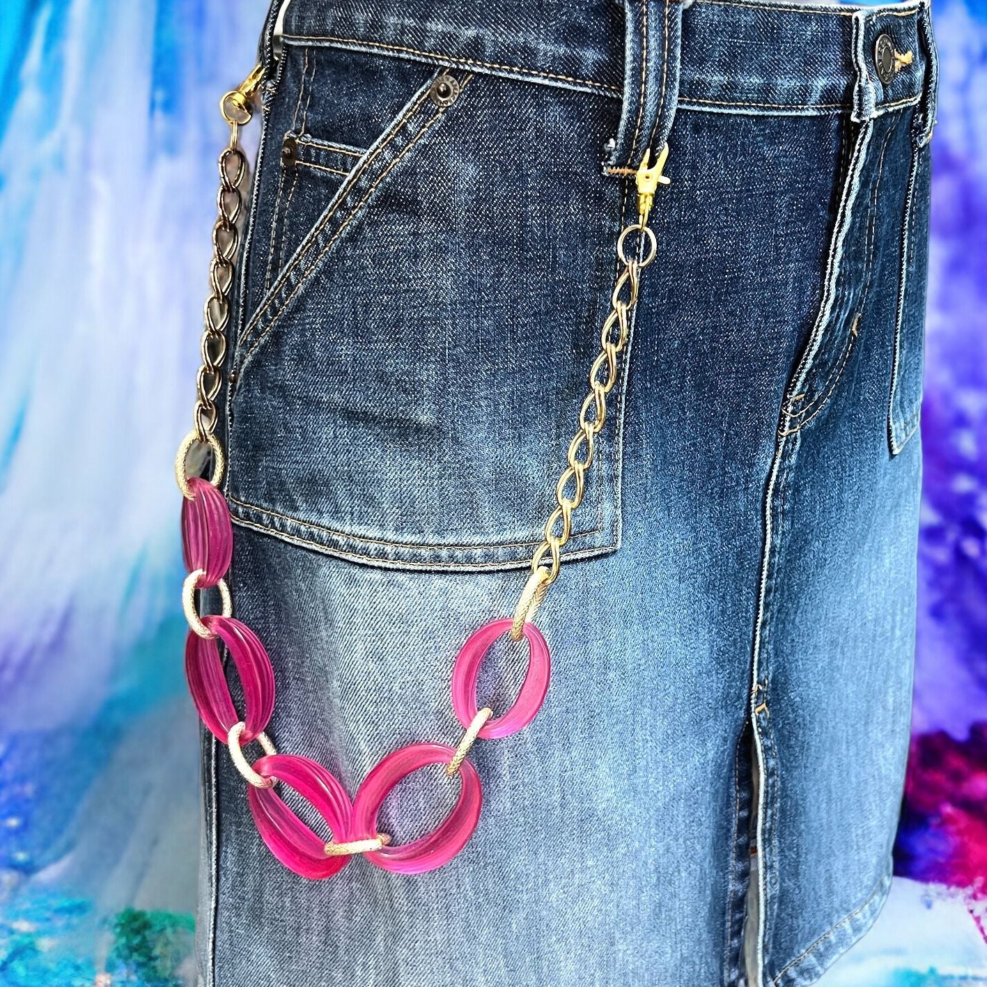 Close-up of Pink Wallet Chain – versatile vintage upcycled jewelry. Tarnished charm adds character. Perfect for festivals, events, or unique everyday style. Displayed on a mannequin.