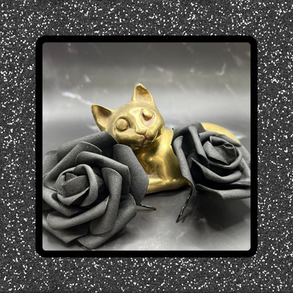 Oversized black rose hairpins by Extra Kitsch, perfect for gothic, romantic, and feminine styles. Lightweight foam for a comfortable and bold look. Displayed on a table.