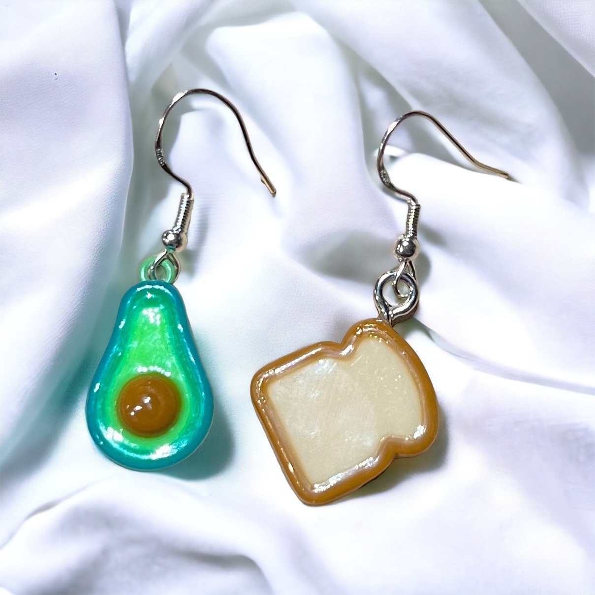 Close-up of Brunch Mini Food Earrings featuring cute Avocado Toast charms. Quirky and delightful accessories for foodie fashion.